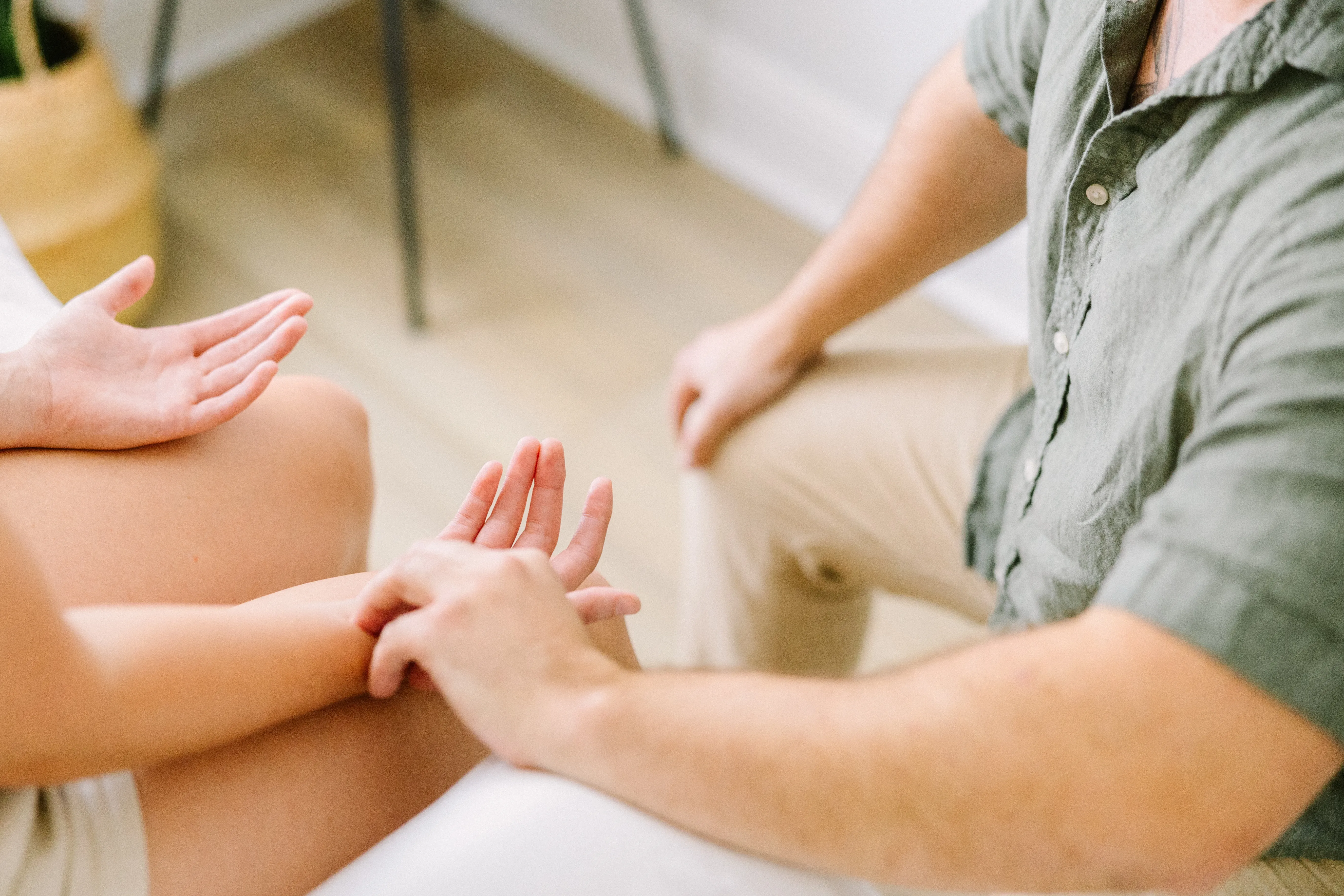 Apollo Acupuncture & Herbal Medicine practitioner taking a patient's pulse in Vista, CA